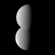 Illustration for article titled Two of Saturns moons merge into one...or so it would seem